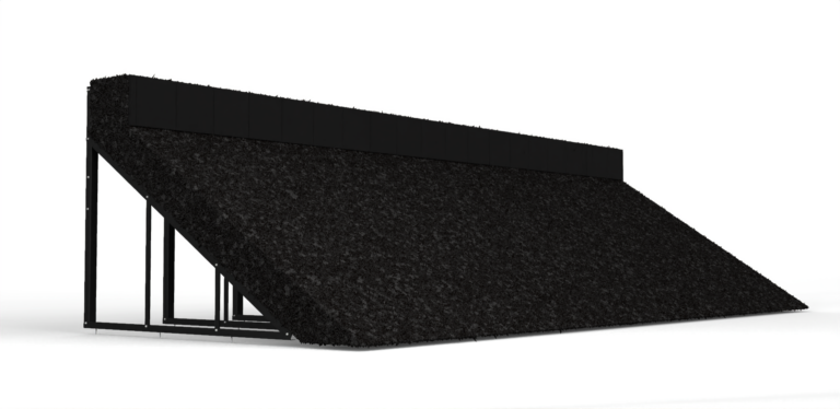 Large black gravel-textured ramp on a metal frame, sloping upward from left to right.